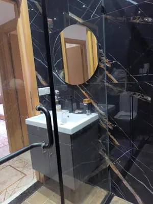 a bathroom with a sink and a mirror at apartment a casablanca in Dar Ben Abdallah Ben Dehbi