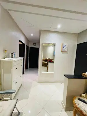 a large kitchen with white tile floors and a room at Chic, quiet and convenient apartment in Casablanca