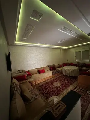 a living room with a couch and a green light at Chic, quiet and convenient apartment in Casablanca