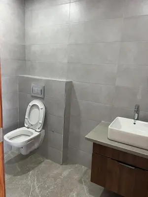 a bathroom with a toilet and a sink at Appartement Casa finance city Studio Haut standing in Casablanca