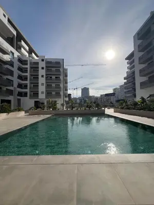 a large swimming pool in the middle of a city at Appartement Casa finance city Studio Haut standing in Casablanca