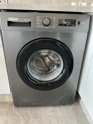 a washing machine with its door open in a kitchen at Appartement Casa finance city Studio Haut standing in Casablanca
