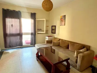 a living room with a couch and a coffee table at Comfortable Room 2 at Homestay Casablanca in Maarif