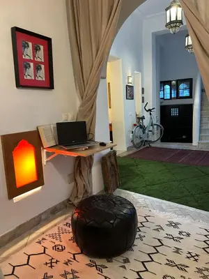 a room with a desk with a laptop on a table at Dar DIESUS NOOR in Azemmour