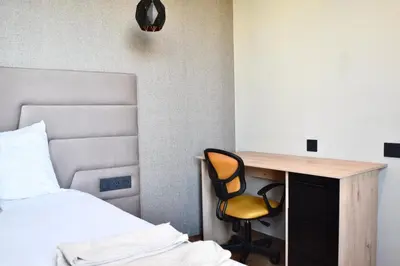a bedroom with a desk and a bed and a desk and a chair at Myhiven Immob in Casablanca