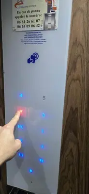a hand is pointing at a video game controller at Myhiven Immob in Casablanca