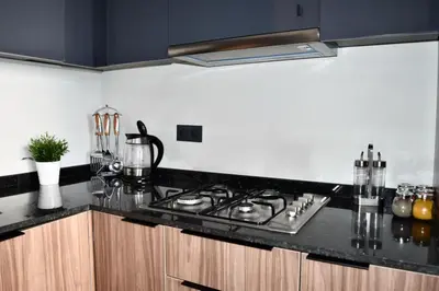 a kitchen counter with a stove top in a kitchen at Myhiven Immob in Casablanca
