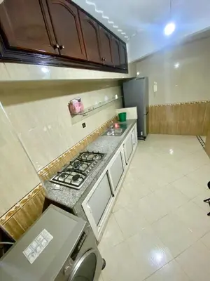 an empty kitchen with a stove and a refrigerator at fabulous Casablanca in Casablanca
