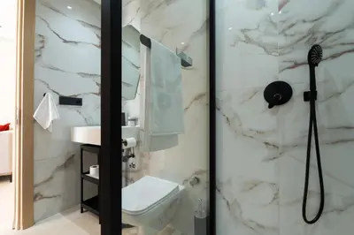 a bathroom with a toilet and a shower at Modern & bright studio Balcony & Parking Maarif in Casablanca