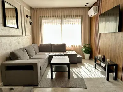 a living room with a couch and a table at Maarif in Casablanca