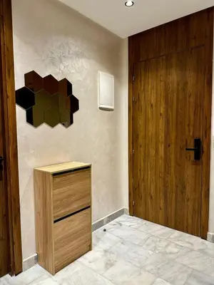 a room with a wooden cabinet and a door at Maarif in Casablanca