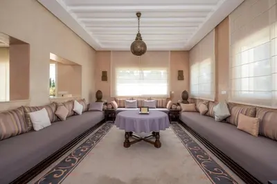 a large waiting room with couches and a table at Superb Villa in Bouznika with Private Pool & Hammam in Bouznika