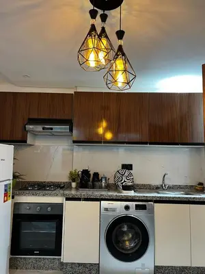 a kitchen with a washing machine and a washer at Skyline Urban - by Nero in Casablanca