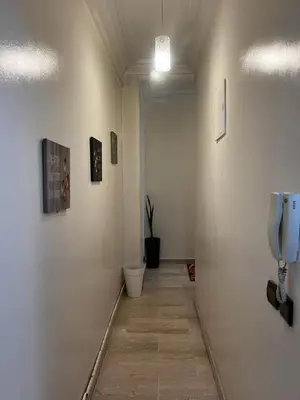 a hallway with a toilet and a phone on a wall at Zen Haven - by Nero in Casablanca