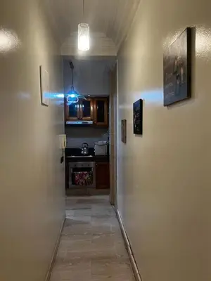 a hallway leading to a kitchen with a door to a room at Zen Haven - by Nero in Casablanca