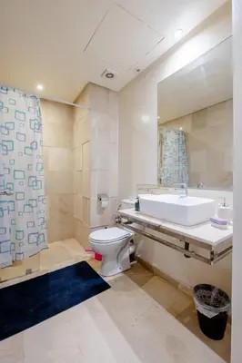 a bathroom with a tub and a toilet and a sink at Comfort Stay by Mohammed V Airport in Nouaseur