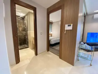 a room with a bathroom with a shower and a door at Welcome to Casablanca in Casablanca