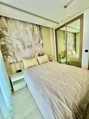 a bedroom with a large bed and a large mirror at Bat infinity living in Casablanca