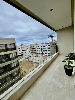 a balcony with a view of a city at Bat infinity living in Casablanca