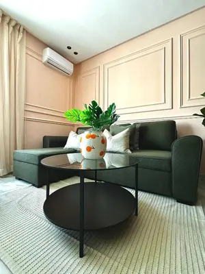 a living room with a couch and a table at Luxury 1-Bedroom Apartment in Maarif in Casablanca