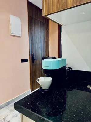 a kitchen with a mixer on a black counter at Luxury 1-Bedroom Apartment in Maarif in Casablanca