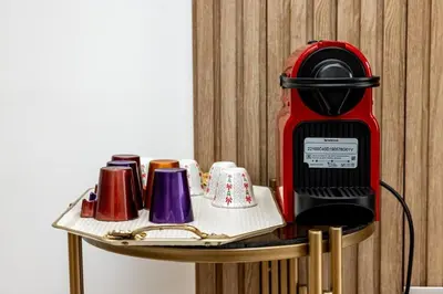 a coffee machine sitting on top of a table at Luxurious and comfortable in Prestigia in Rabat