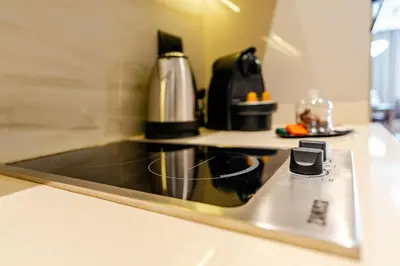 a kitchen with a stove top with a coffee pot at Corniche Guest idéal pour un séjour Inoubliable in Casablanca