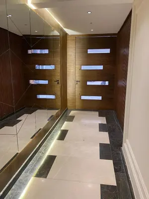 a walk in closet with glass doors and a tile floor at Appt 1 ch meublé CFC TO CLOSE in Casablanca