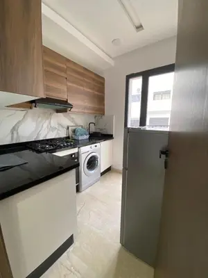 a kitchen with a stove and a dishwasher at Appt 1 ch meublé CFC TO CLOSE in Casablanca