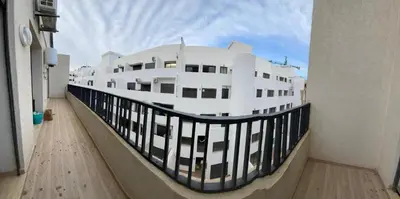 a large white building with a black railing at Appt 1 ch meublé CFC TO CLOSE in Casablanca