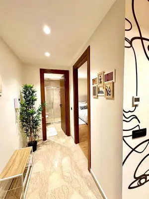 a living room with a hallway with a mirror at Charming studio located in Tadart in Casablanca