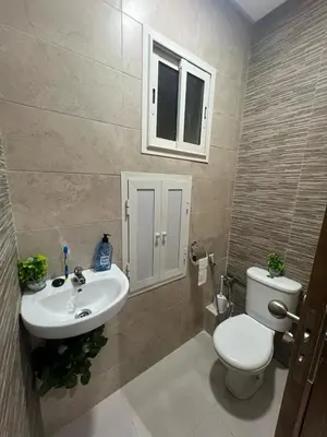a bathroom with a toilet and a sink at Dar al bahr in Rabat