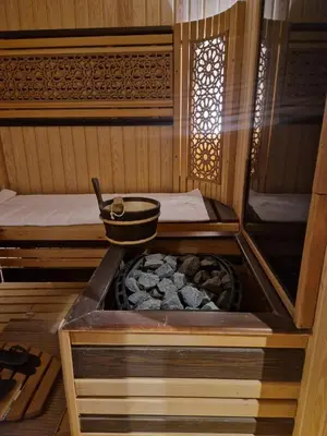 a inside of a sauna with a pot on top at Palm Palace Bouznika in Bouznika