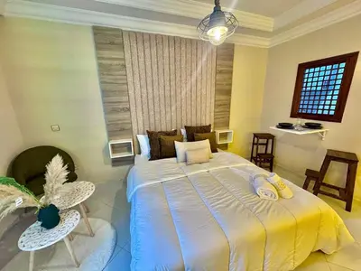 a bedroom with a large bed in a room at cosy studio au cœur de rabat agdal in Rabat