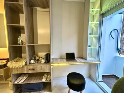 a room with a desk with a laptop on it at cosy studio au cœur de rabat agdal in Rabat