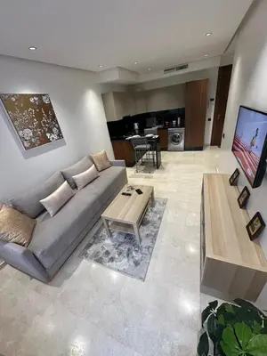 a living room with a couch and a table at Résidence Signature Leving in Maarif