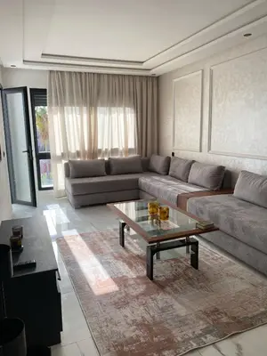 a living room with a couch and a coffee table at Appartement in Casablanca
