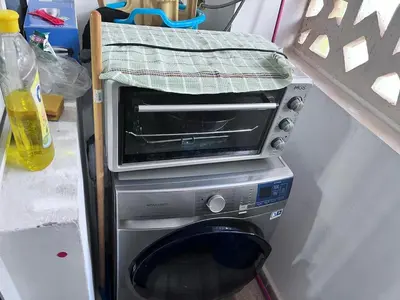 a toaster oven sitting on top of a microwave at Beachfront apartment in Rabat