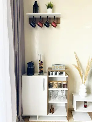 a room with a white cabinet and shelves with cups at Ocean view & sunset in the heart of Rabat 2 in Rabat