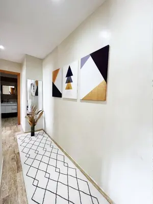 a room with paintings on the wall at Ocean view & sunset in the heart of Rabat 2 in Rabat