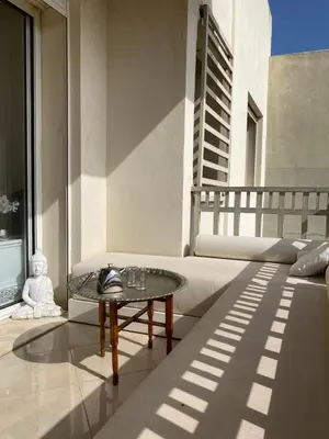 a living room with a couch and a table at Dar Bouazza piscine Bab Rayan in Casablanca