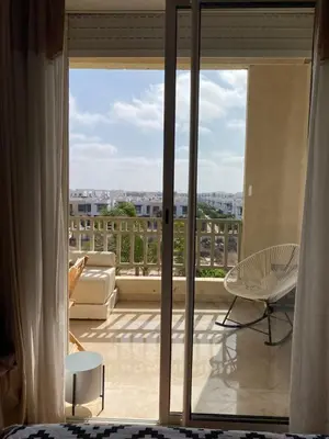 a view of a living room with a view of a balcony at Dar Bouazza piscine Bab Rayan in Casablanca