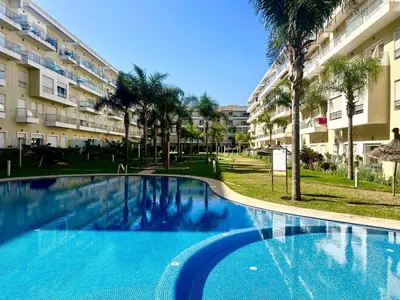 a large swimming pool in front of a building at Les Jardins de Bouznika Premium - Votre espace familial in Bouznika