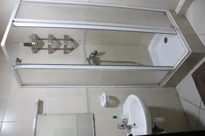 a bathroom with a mirror and a sink and a toilet at Bienvenue à Casablanca centre idéal pro ou famille in Casablanca