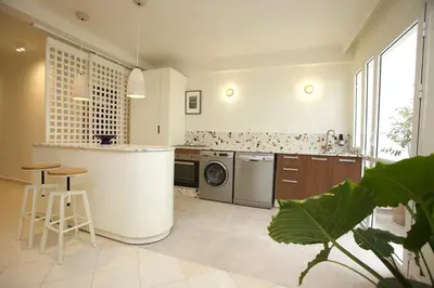 a kitchen with a sink and a dishwasher at Cozy apartment 5 minutes from Casa Voyageurs in Casablanca