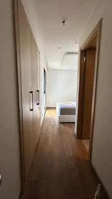 an empty room with a bed and a hallway at Modern and cozy accommodation in Rabat in Rabat