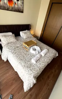a bed with two towels and a tray on it at Great for families and couples in Casablanca