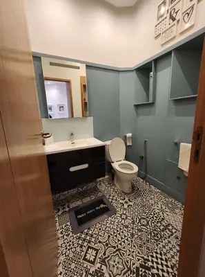 a bathroom with a toilet and a sink and a mirror at appartement Gautier in Casablanca