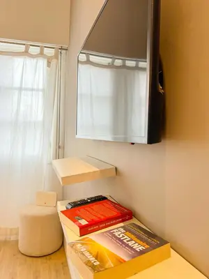 a kitchen with two books on a counter and a cabinet at appartement Gautier in Casablanca