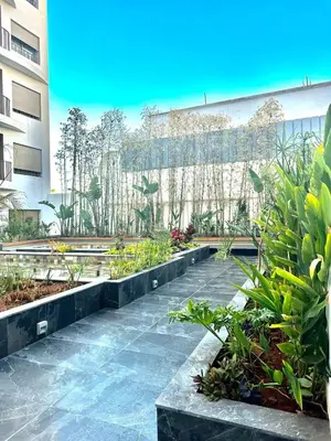 a garden in a building with plants at Beautiful apartment in Tadart in Casablanca